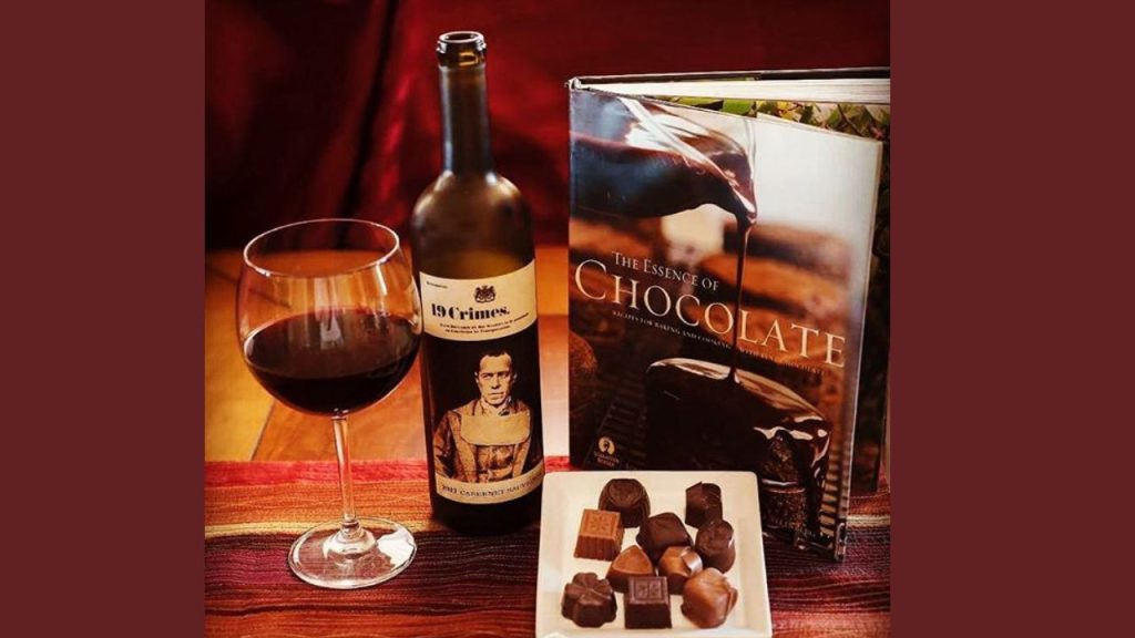 Photo of red wine and chocolates by The Chocolate Therapist.